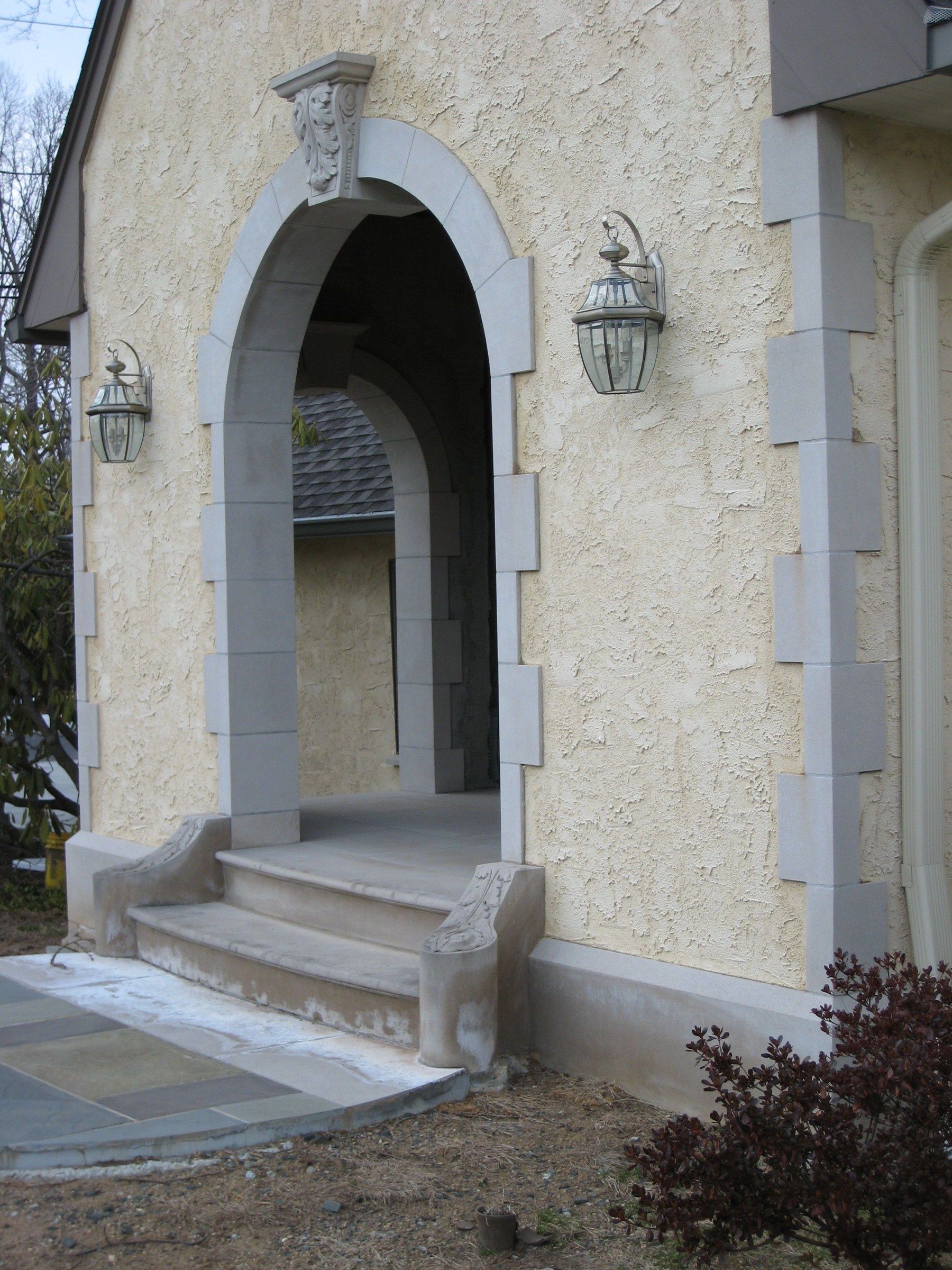 The steps in place at the foot of an arched entrance.