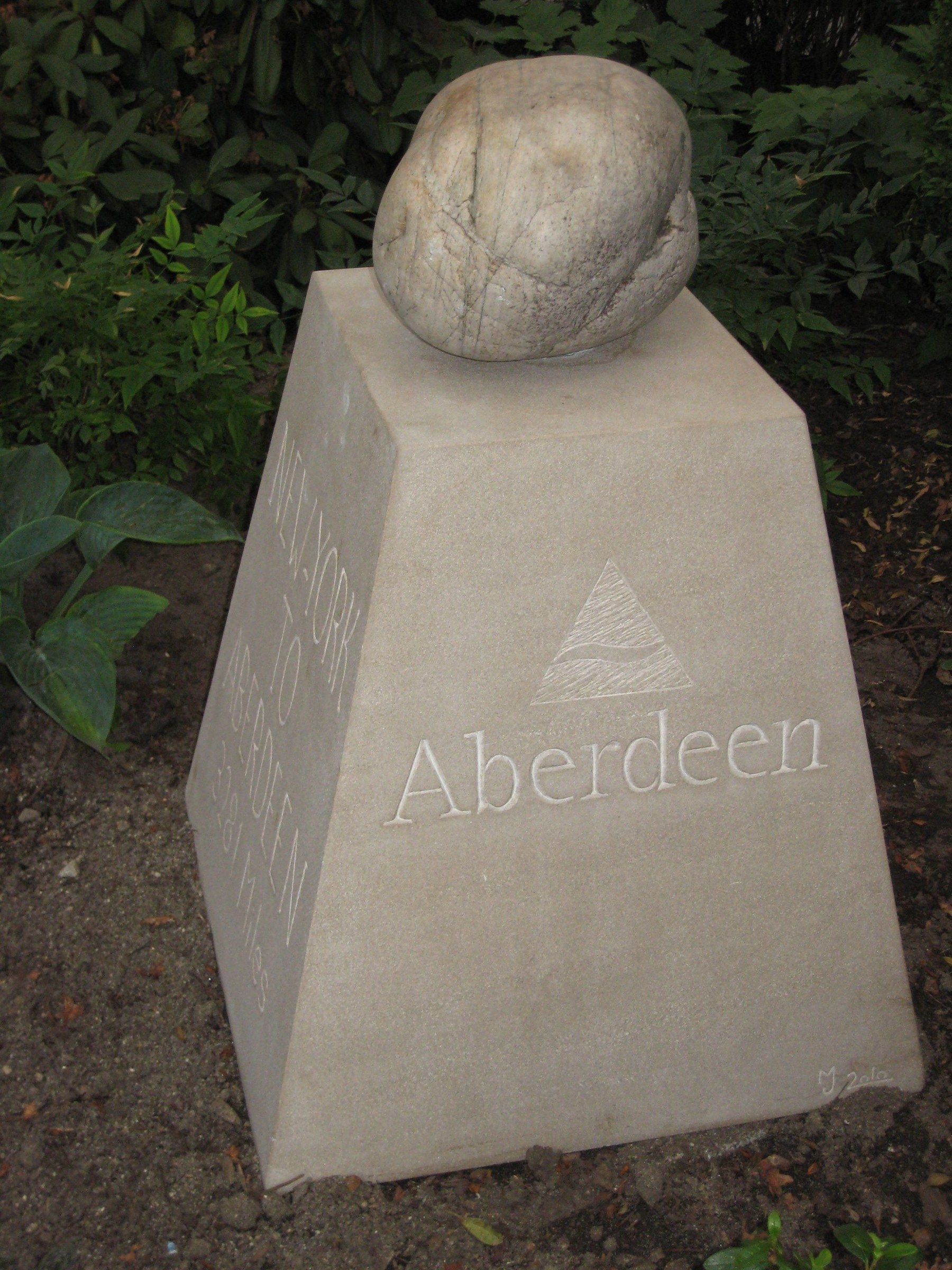 The face of the marker carved with a triangular emblem above the word “Aberdeen.”
